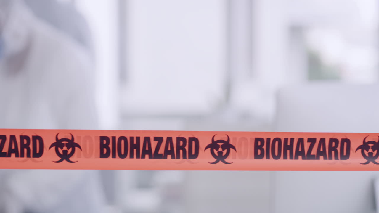 Orange biohazard barrier tape blocking
