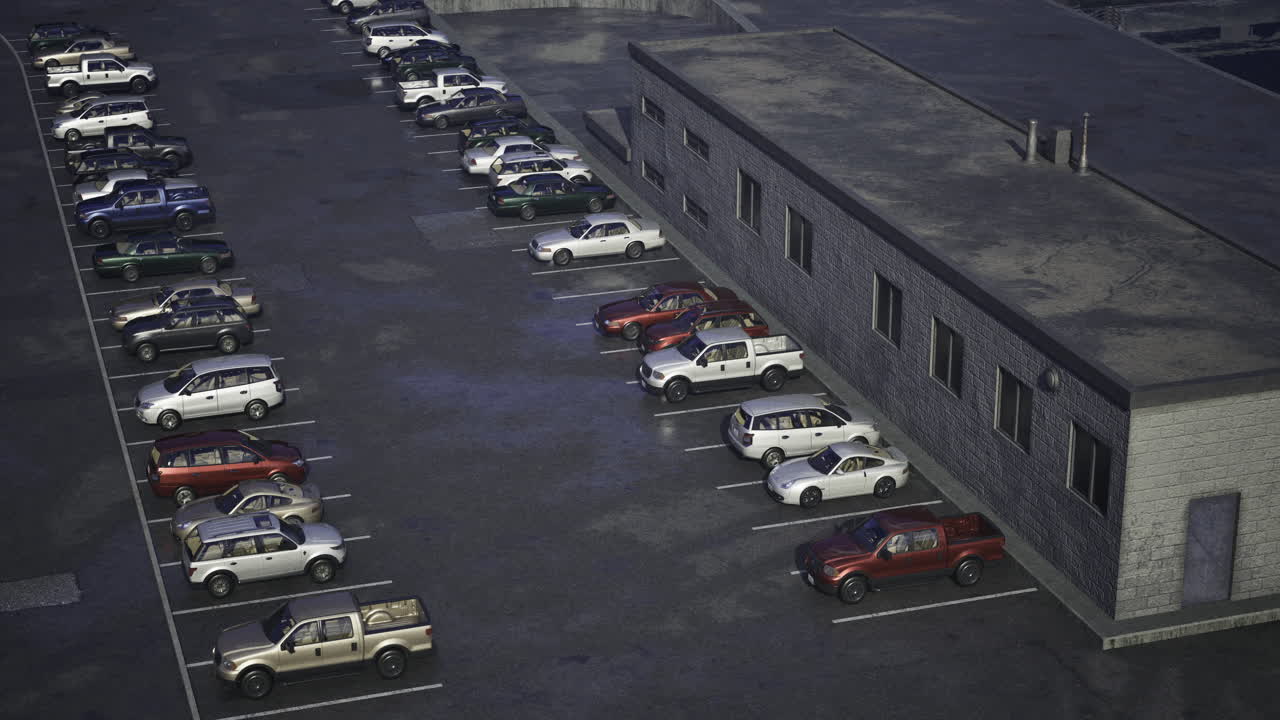 Evening parking lot with various vehicles near a commercial building