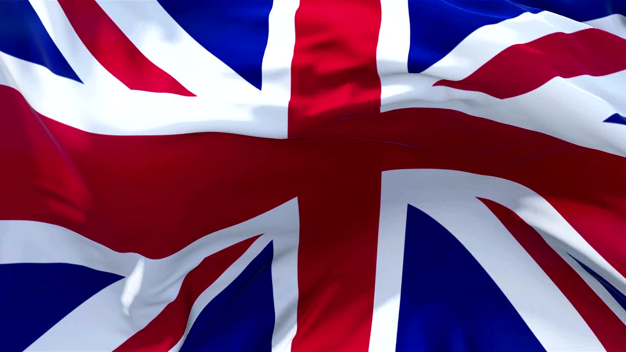 UK Flag in Slow Motion Classic Flag Smooth blowing in the wind on a windy day rising sun 4k Continuous seamless loop Background