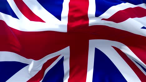 uk flag in slow motion classic flag smooth blowing in the wind on a windy day rising sun 4k continuous seamless loop background