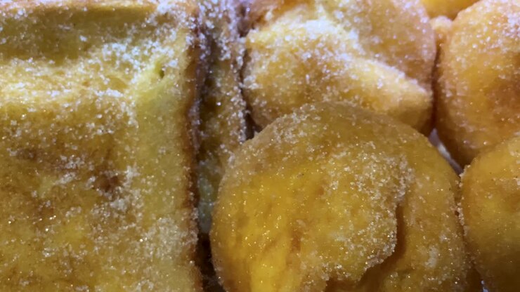 Bolas de Berlim in Portugal, served warm on the beach during hot summer days