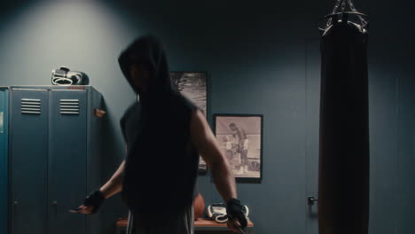 man jumping rope in boxing gym