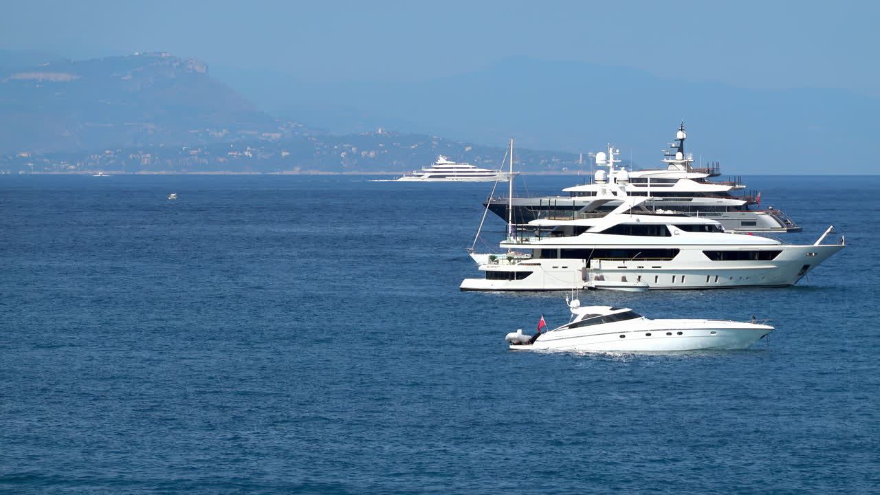 White boats moving on the sea in Antibes, France