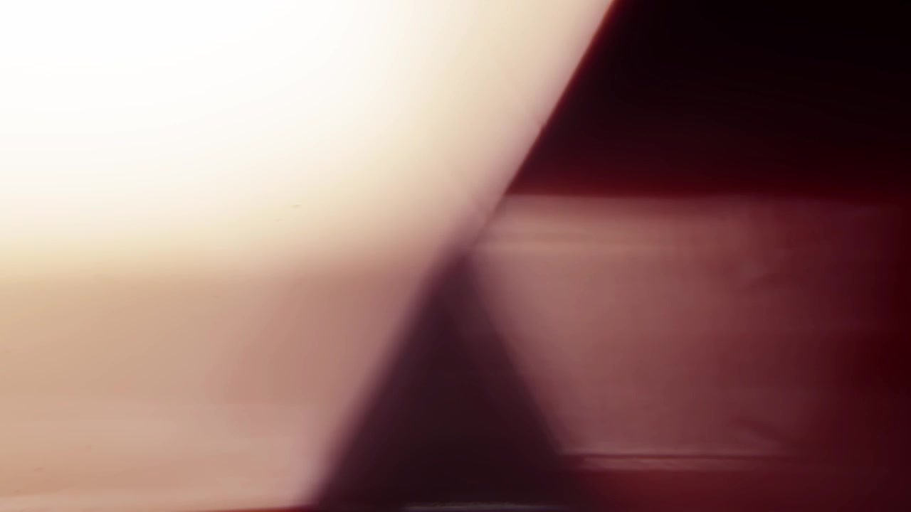 Abstract Warm Light Leaks and Lens Flares Transitioning on Dark Background