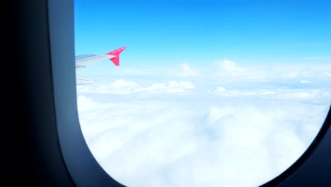 the view from the window of the plane on the wing and clouds.