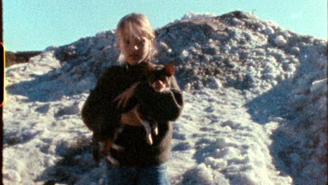 girl with a dog in the snow