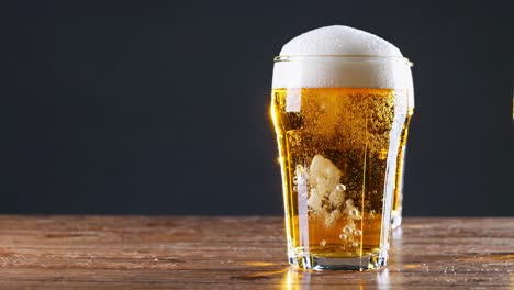 glass of beer on a wooden table