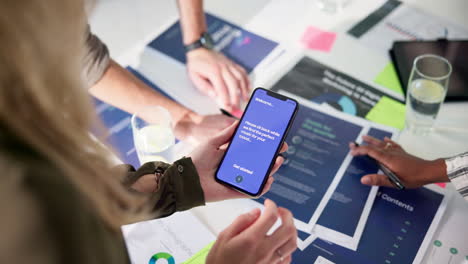 business meeting with data analysis on smartphone