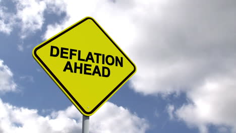 Deflation-ahead-sign-against-blue-sky-