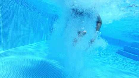 Boy jumping in pool. Boy jumping in cool water of swimming pool