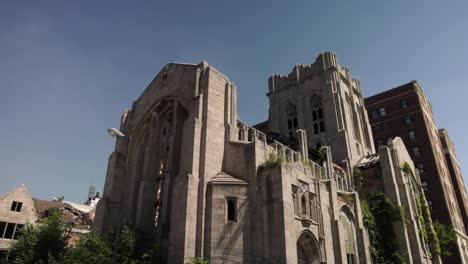 Abandoned-historic-City-Methodist-Church-in-Gary,-Indiana-with-gimbal-video-close-up-panning-left-to-right-in-slow-motion