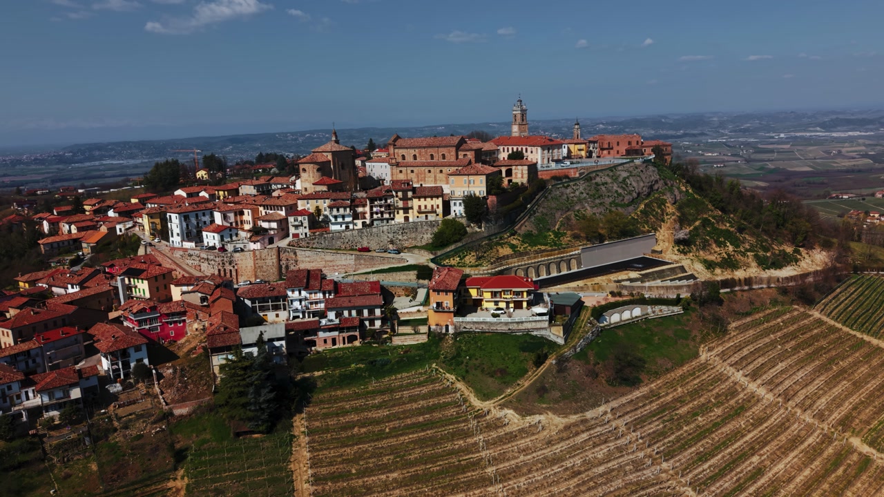 Panoramic view of La Morra hilltop village and Langhe vineyards in Piedmont, Italy, aerial drone