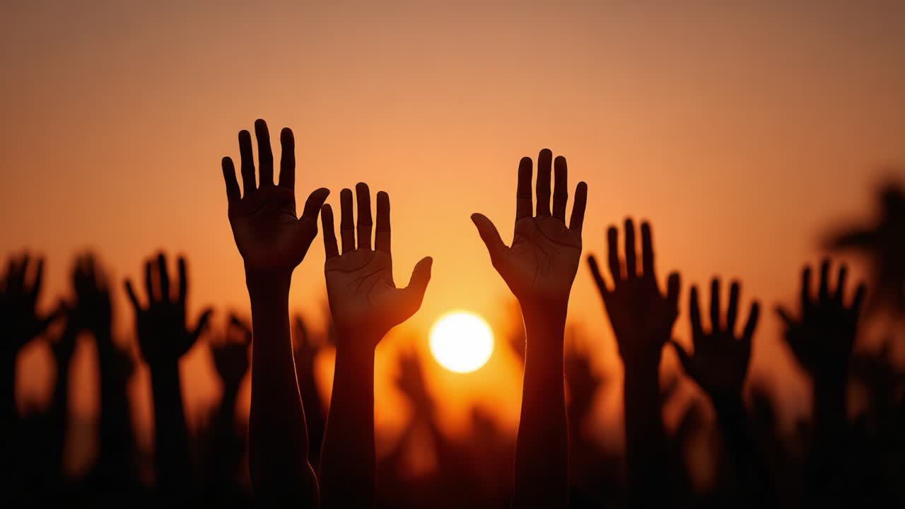 A Powerful Sunset Silhouette of Raised Hands, Symbolizing Hope, Unity, and Collective Aspiration as the Day Transitions into Night