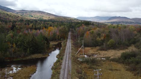 drone view along androscoggin river train tracks