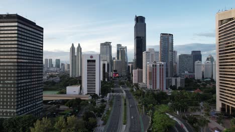 aerial jakarta view from above sudirman street in the morning with building and rush hours view