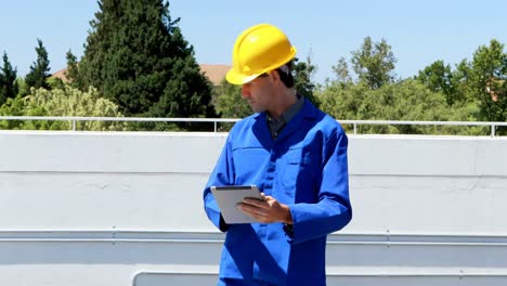 male worker using digital tablet at solar station 4k