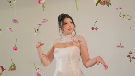 A Graceful Bride in a Stunning Gown Poses with Flowers Creating a Romantic and Enchanting Atmosphere a Graceful Bride in a Stunning Gown Poses with Flowers Creating a Romantic and Enchanting Atmosphere