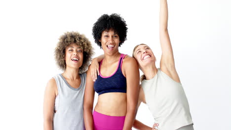 Diverse-group-of-friends-wearing-sporty-outfits,-stretching-and-smiling