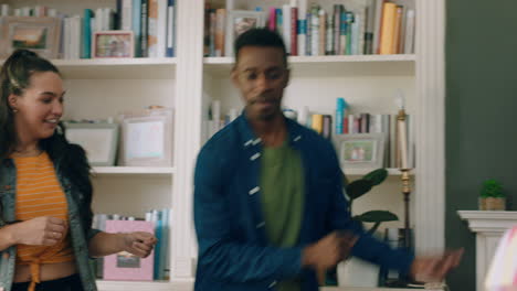 happy multiracial family dancing at home having fun enjoying dance celebrating exciting weekend together