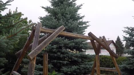 wooden swinging bench in a park