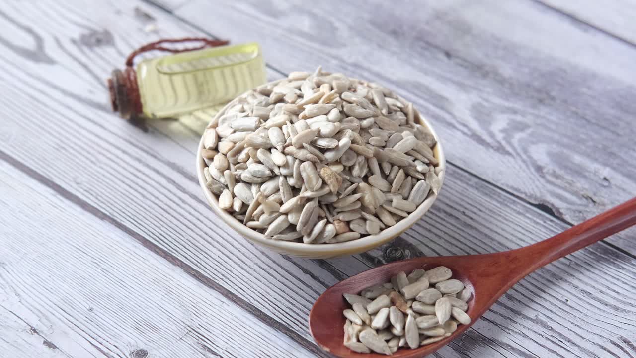 Sunflower Seeds in a Bowl and Spoon