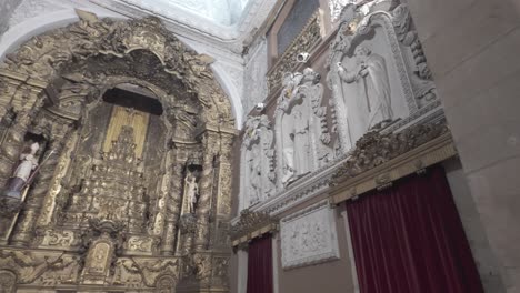 ornate church interior with detailed architecture and stained glass windows in porto, portugal