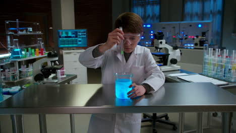 a young boy in a lab coat conducting a science experiment