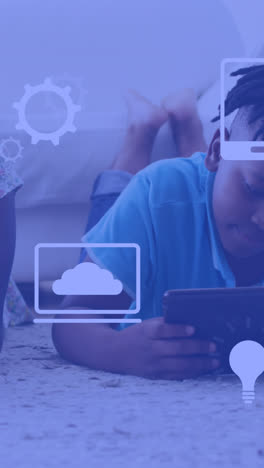 animation of technology icons over african american siblings using technology
