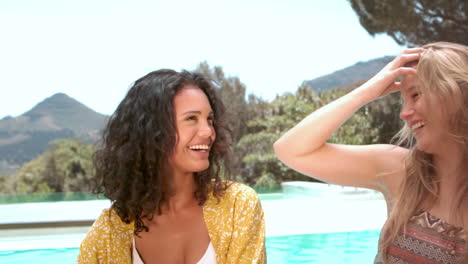 friends talking by the pool