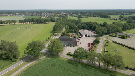 aerial overview of agricultural company with heavy machinery on lot