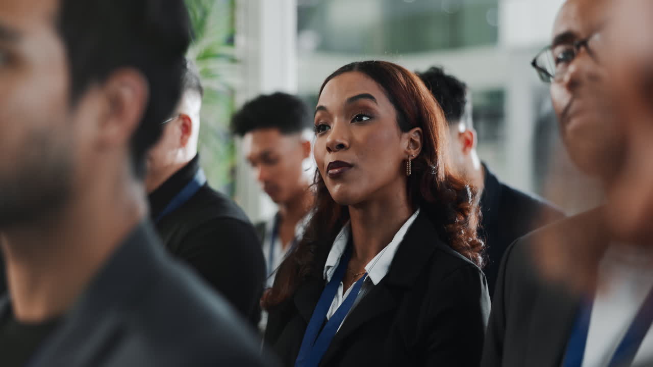 Business Meeting Attendees Listening to a Presentation