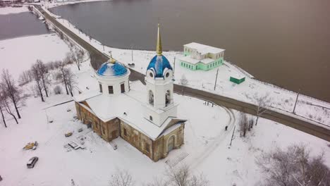 snowy orthodox church in a russian village