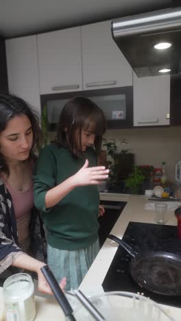 mother and daughter cooking together