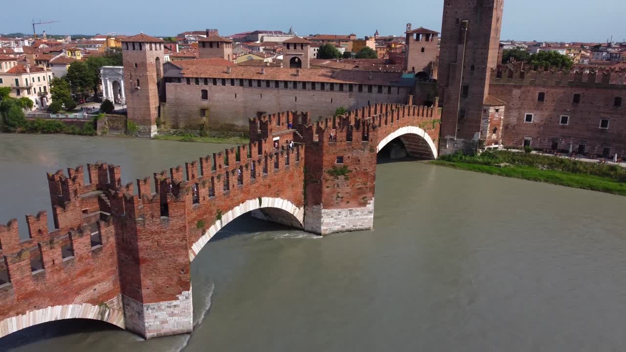 Drone view of stunning medieval Scaliger Bridge (Ponte Scaligero) leading to Castelvecchio in Verona on Adige River - Italy
