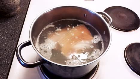 preparing soup, simmering pork for delicious soup - cooking pork cabbage soup