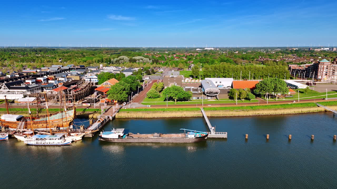 Wharf and museum Batavia Land in Lelystad, Netherlands. Beautiful scenery of the green cityscape from drone.