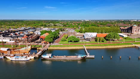 wharf and museum batavia land in lelystad, netherlands. beautiful scenery of the green cityscape from drone.