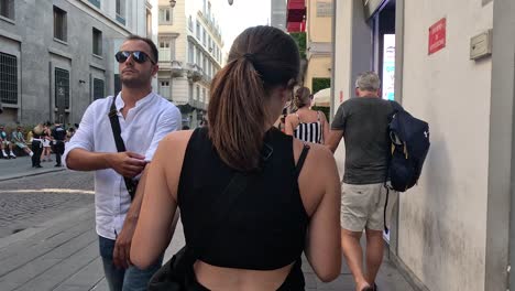 people walking and interacting on naples street