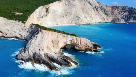 aerial of porto katsiki beach in lefkada with stunning landscape views and turquoise water bordered by steep cliffs