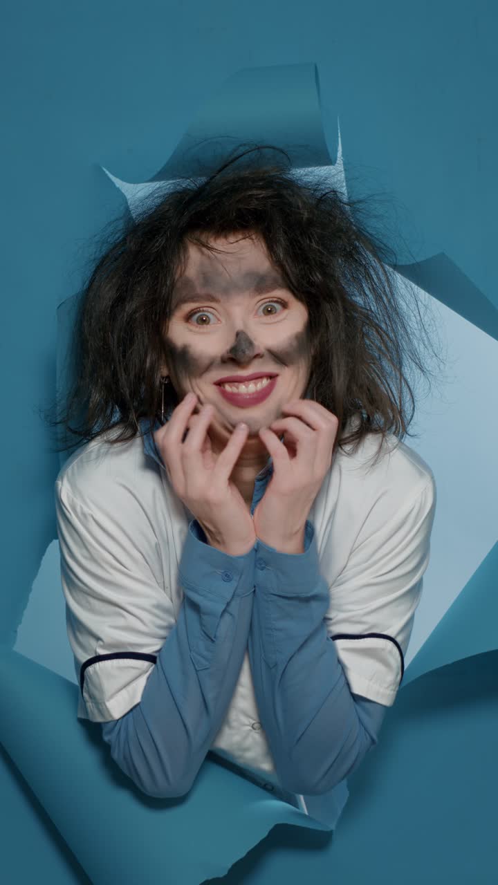 Woman with Smudged Makeup in Torn Paper