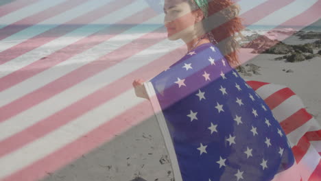 walking on beach, woman wrapped in american flag with animation of flag colors