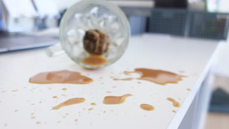 spilled coffee on white desk