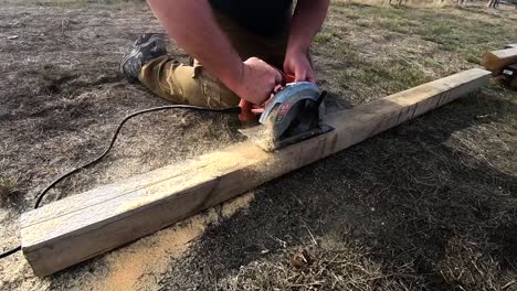 cutting a 4x4 wooden post with a circular saw