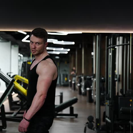 brutal guy in sportscenter. handsome sportsman with muscular body in the modern fitness center. sportive lifestyle
