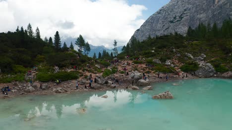 rising aerial shot of adige lake sorapis in italy