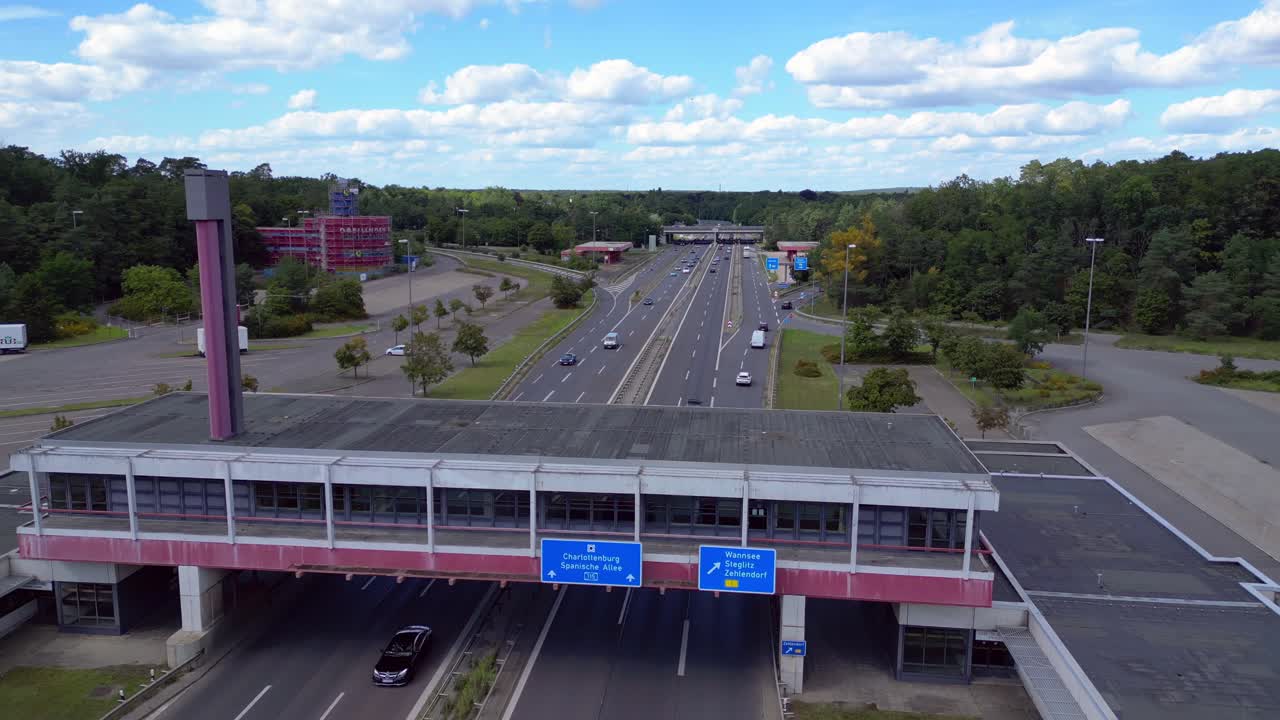 Dreilinden Checkpoint Bravo border crossing. German freeway traffic on sunny day with blue sky. Fantastic aerial view flight overflight flyover drone
