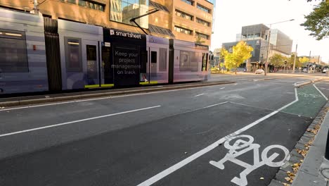 a tram moves along a city street