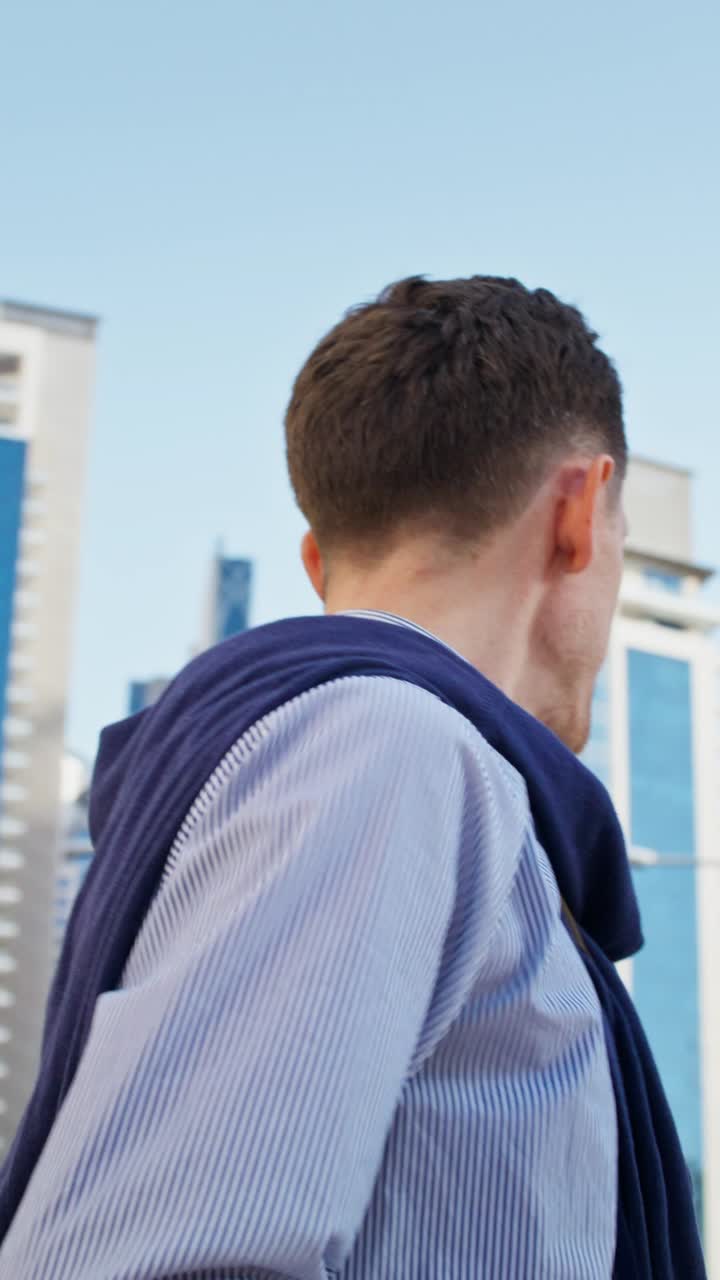 Businessman drinking coffee in city
