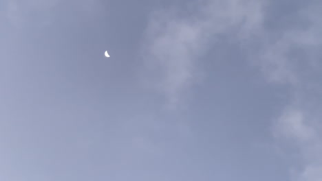 the moon on the cloudy sky in the morning