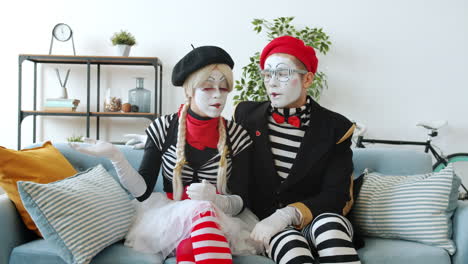 mime couple on a sofa